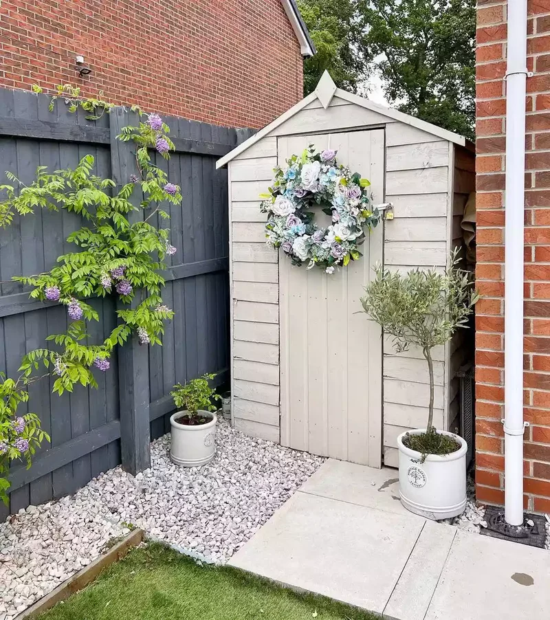 15 Clever Garden Hose Storage Solutions for Your Backyard 7 Keep It in a Garden Shed