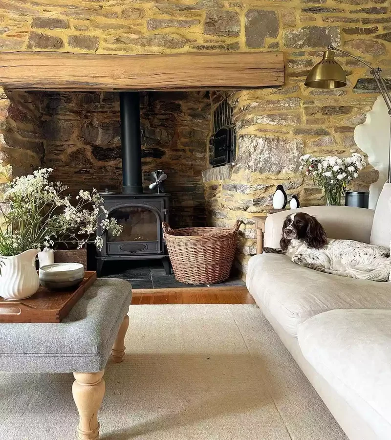 40 Cozy and Inviting Country Living Room Design Ideas 14 Let Exposed Stone Shine