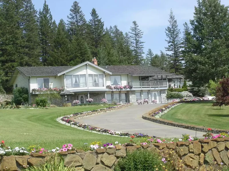 Low Stone Wall Landscaped Driveway Entrance