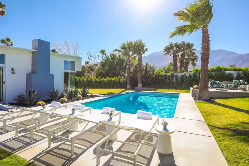 39 Contemporary Backyard Ideas to Elevate Your Outdoor Oasis 35 Mix in a Patterned Sofa