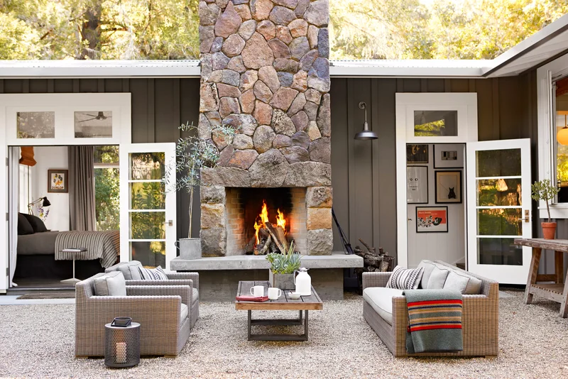 39 Outdoor Fireplace Designs for Your Cozy Retreat Space 18 Outdoor Patio with Stone Fireplace