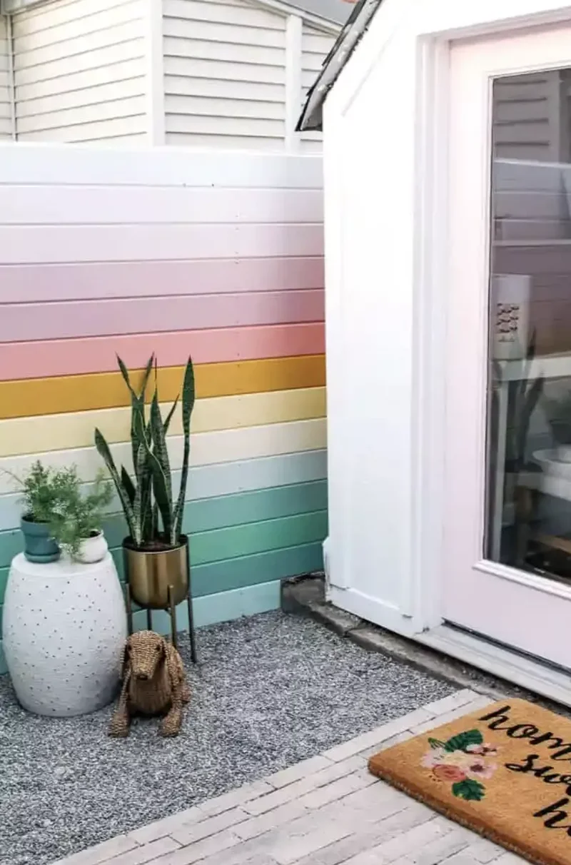 30 Creative Fence Decorating Ideas to Transform Your Yard 8 Paint a Rainbow Pattern