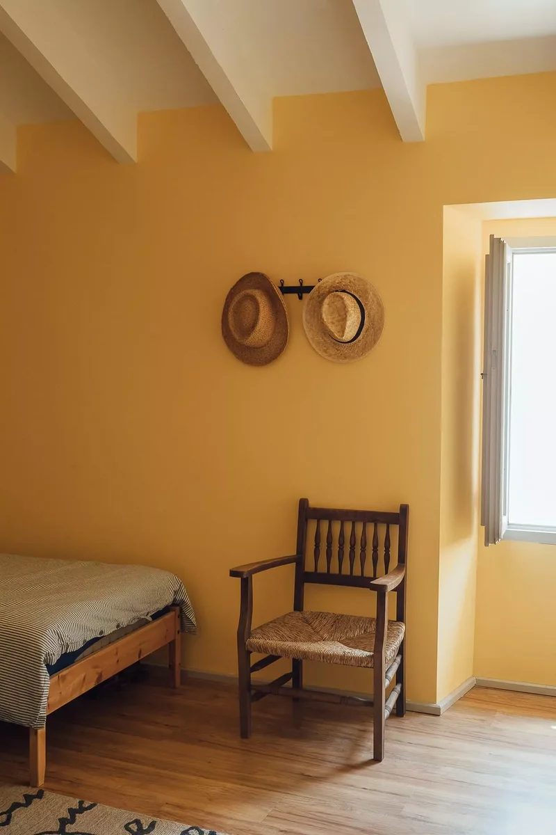 37 Guest Bedroom Ideas to Make Visitors Feel at Home 7 Paint the Walls Yellow