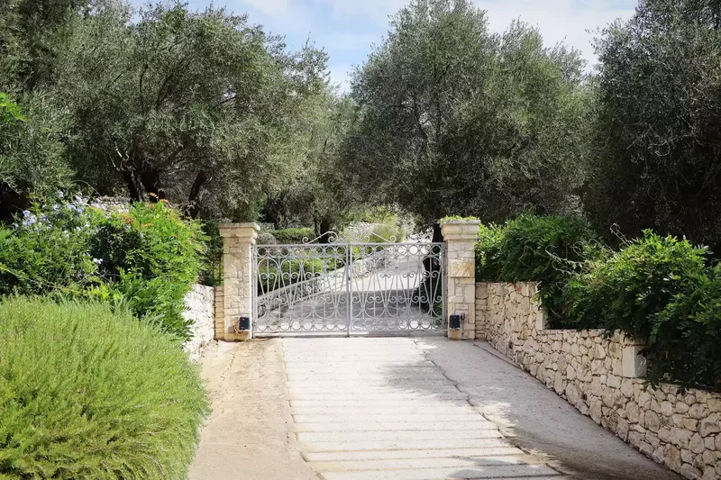 35 Beautiful Driveway Gate Ideas for Any Home Style 24 Painted Wrought Iron