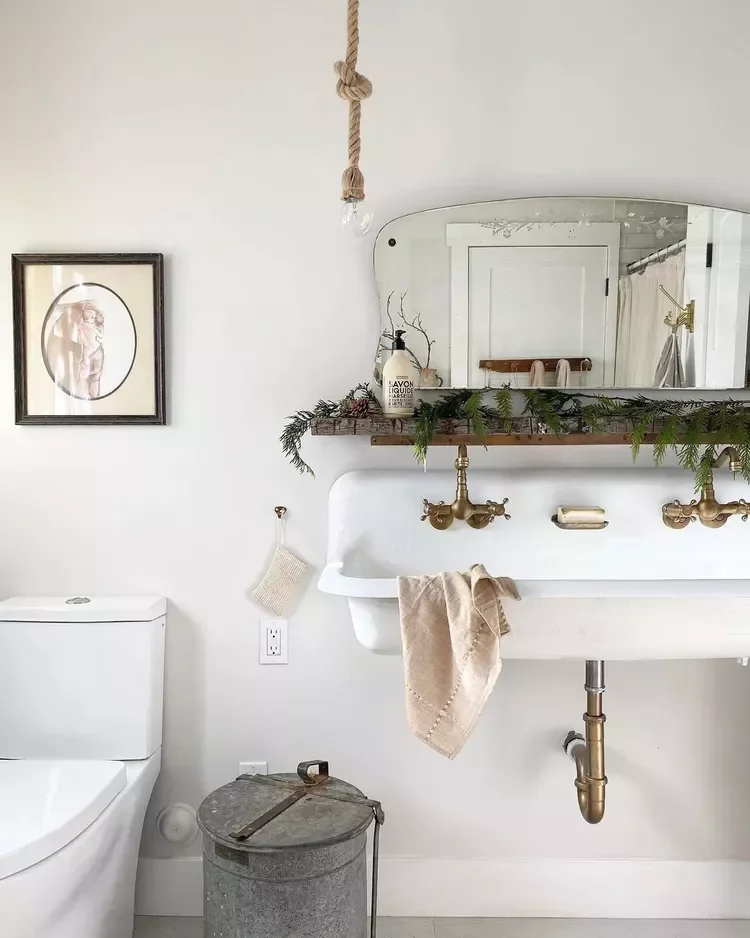 Decorating Your Bathroom for Christmas: 32 Festive Ideas 17 Pair Greens and Pinecones