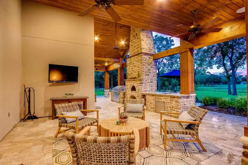 16 Patio Extension Ideas to Instantly Expand Your Space 7 Patio Extension With Stone Fireplace and Roof