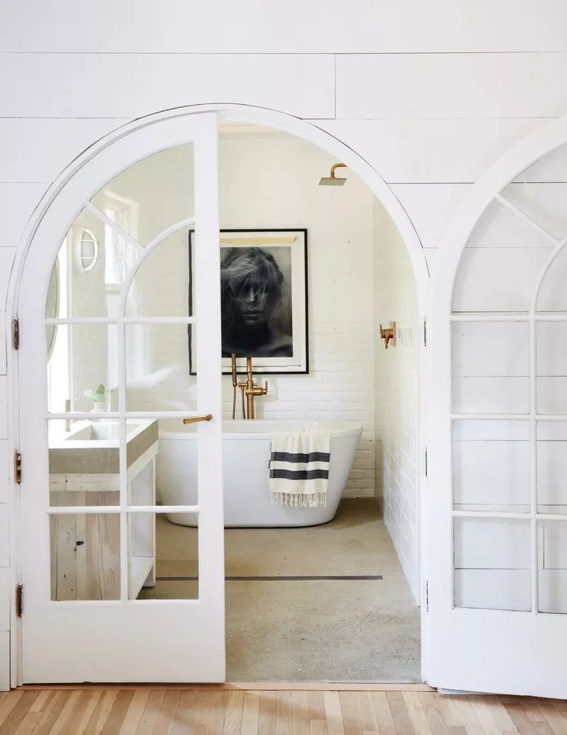 32 Modern Farmhouse Bathroom Designs That Never Go Out of Style 3 Repurpose Vintage Doors
