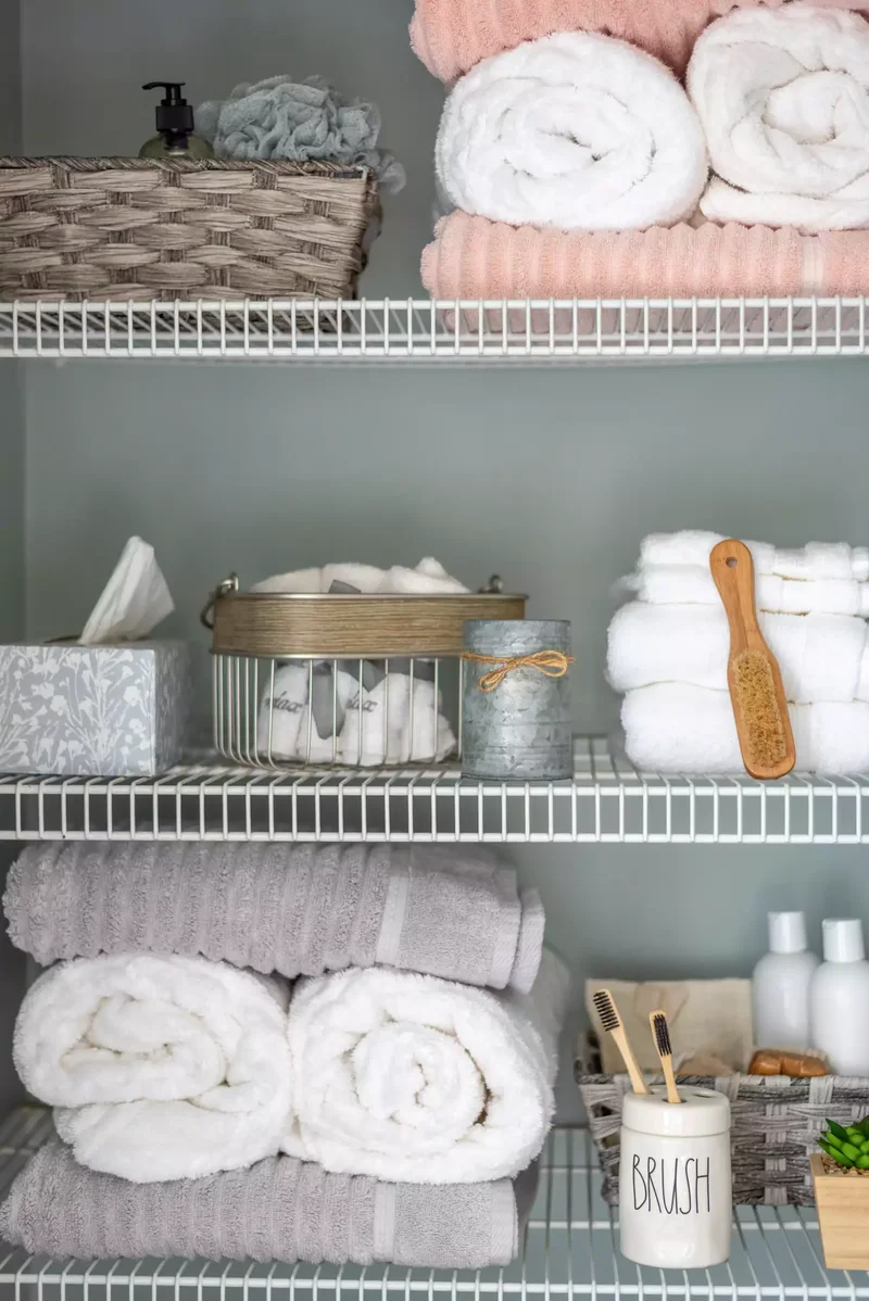 24 Smart Ways to Organize Your Bathroom Closet Beautifully 16 Roll Your Towels