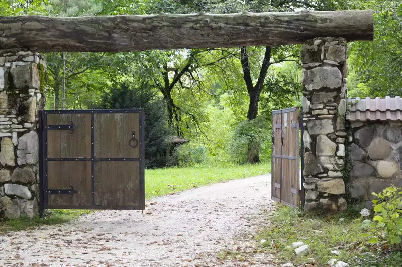 Rustic Wood Gate and Stone Entrance