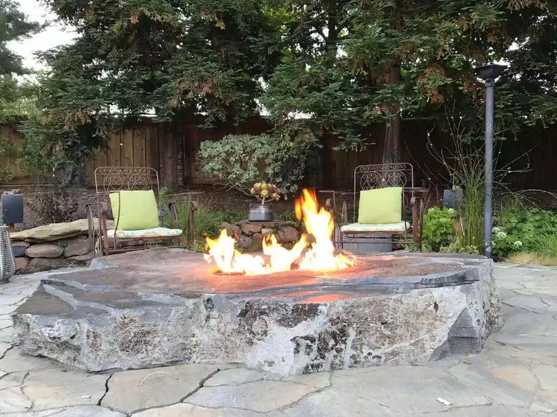 21 Rustic Stone Fire Pit Ideas for Your Outdoor Retreat 13 Sliced Boulder Fire Pit