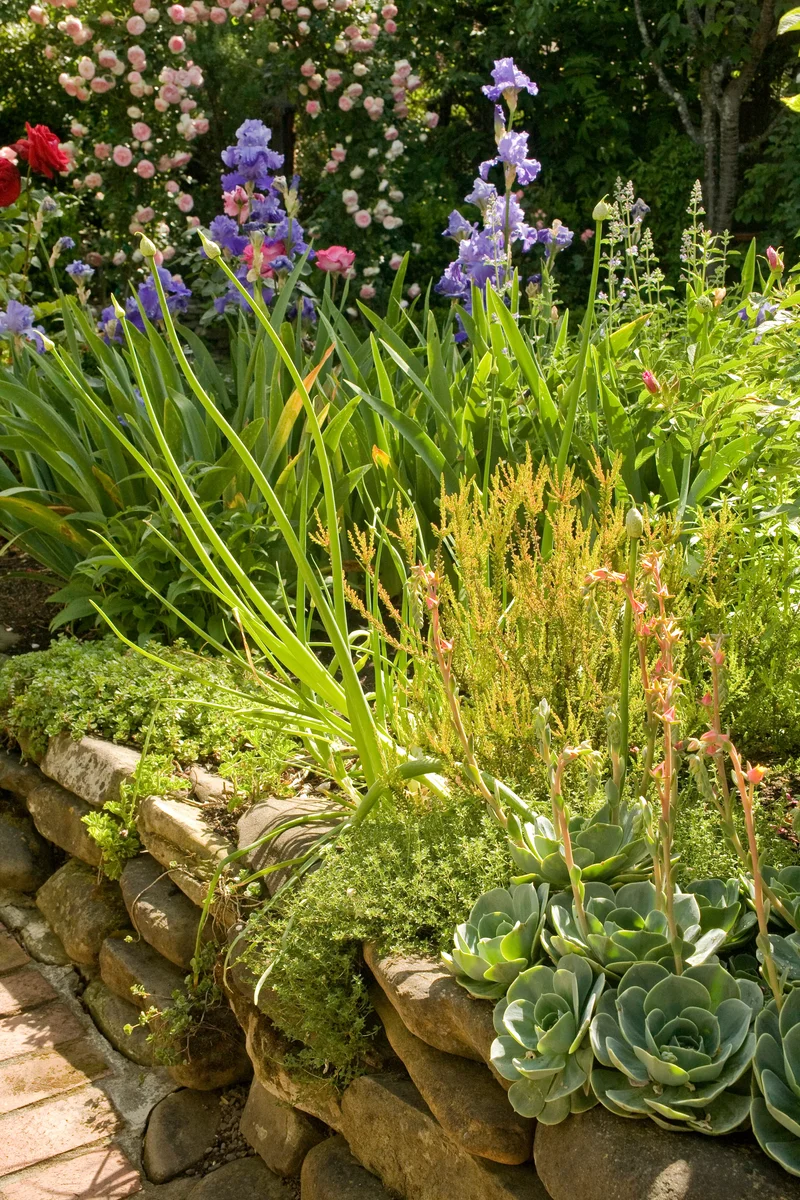 25 Beautiful Raised Garden Bed Ideas for Veggies & Flowers 9 Stacked Stone Bed