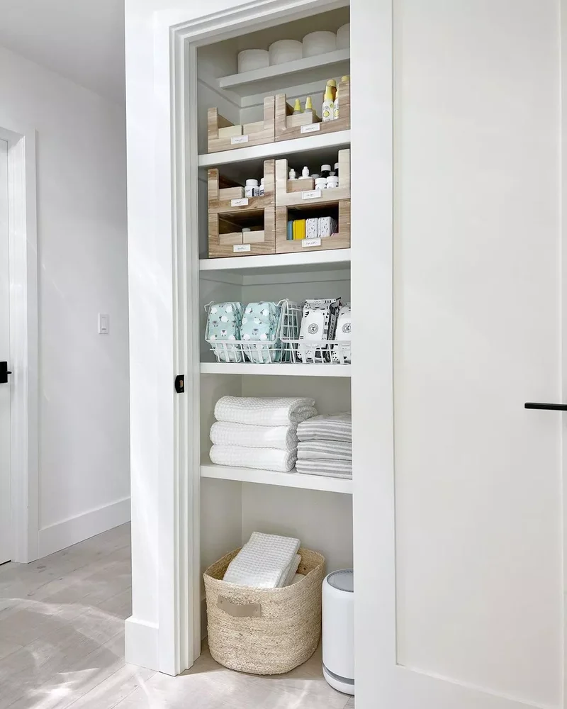 32 Clever and Beautiful Towel Storage Solutions 8 Store Extra Towels in a Basket