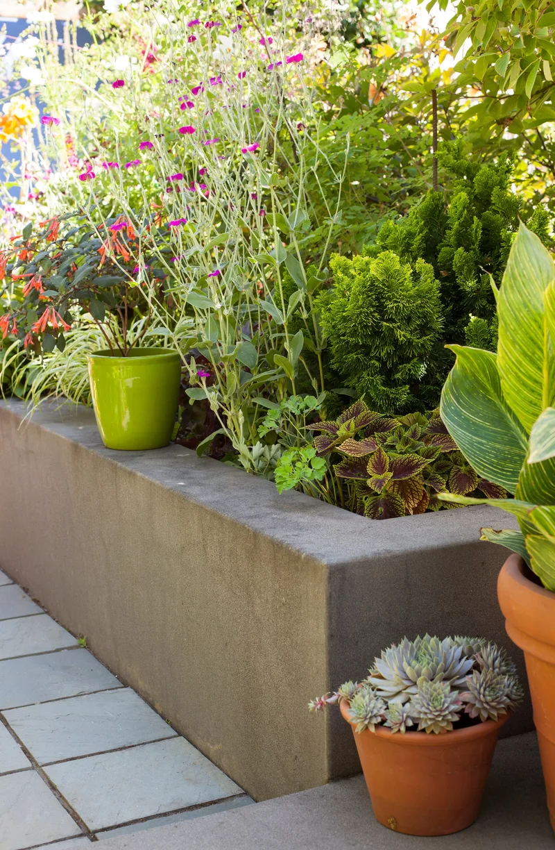 25 Beautiful Raised Garden Bed Ideas for Veggies & Flowers 1 Stucco Raised Bed