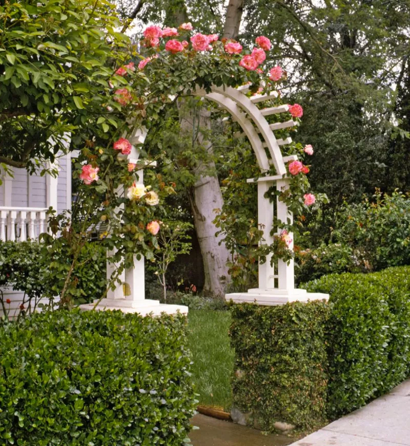 20 Beautiful Garden Arbor Ideas for Your Outdoor Oasis 3 Surround the Arbor in Greenery