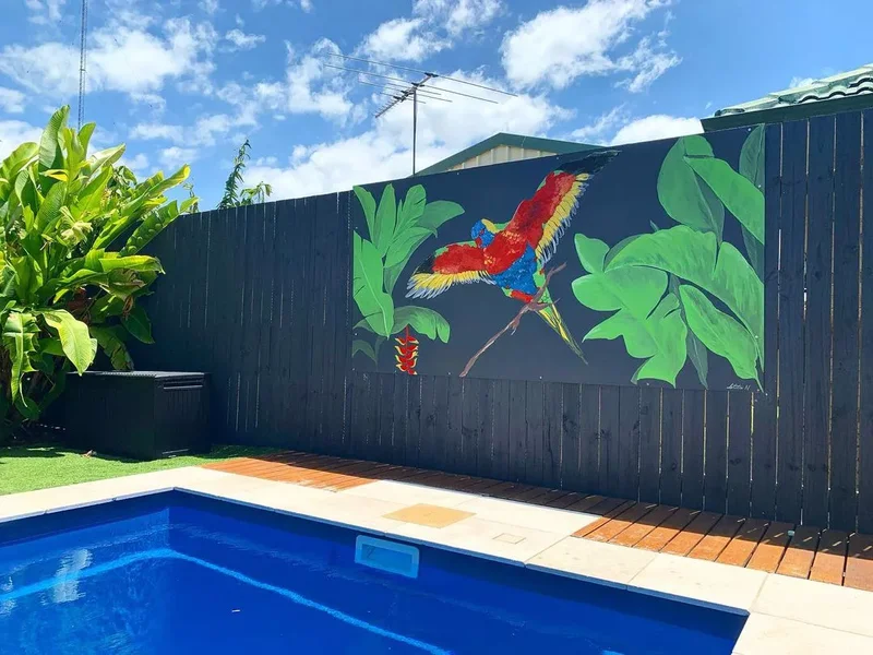 30 Creative Fence Decorating Ideas to Transform Your Yard 12 Think Tropical With a Bold Mural