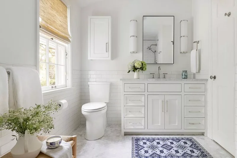 17 Stylish Over the Toilet Storage Ideas for Your Bathroom 7 Try a Cabinet With Door