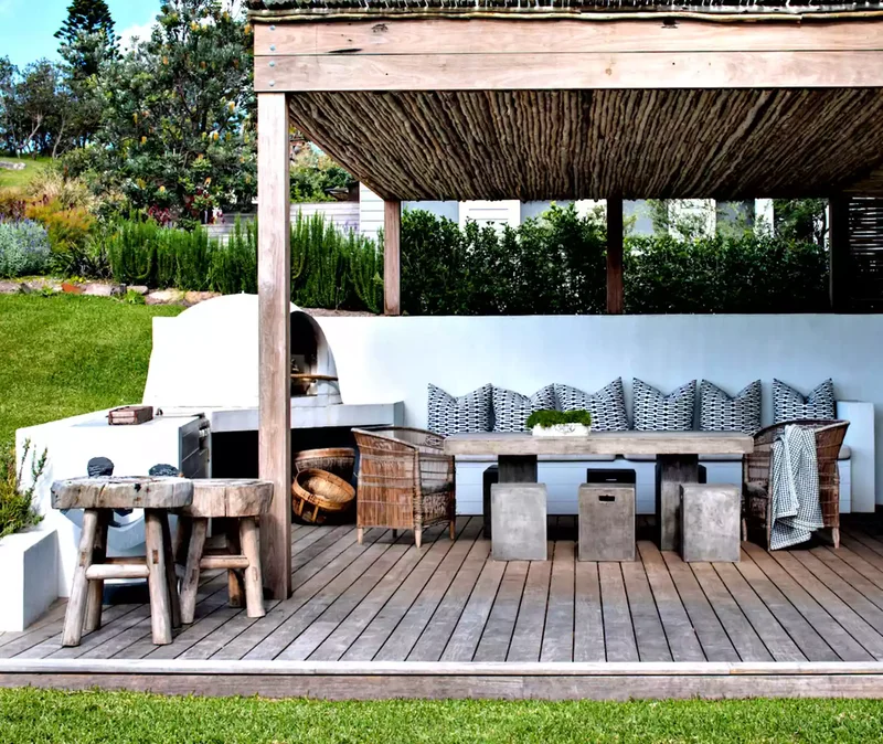 24 Covered Deck Designs to Create Shaded Outdoor Spaces 11 Try a Thatch-Style Roof