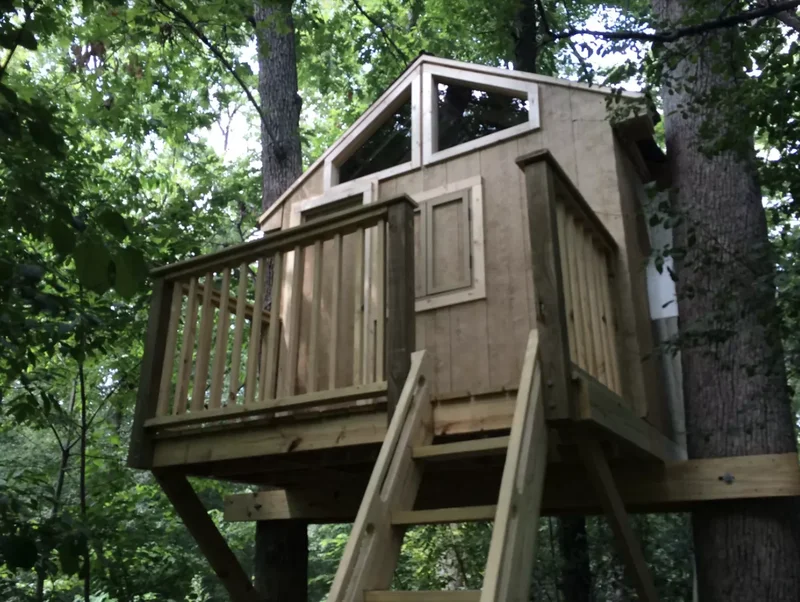 28 Creative Treehouse Ideas Your Kids Will Absolutely Love 28 Tuck a Treehouse Between Two Oaks