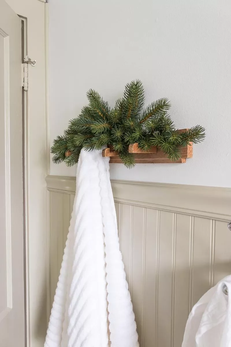 Decorating Your Bathroom for Christmas: 32 Festive Ideas 6 Use an Easy Faux Pine Swag