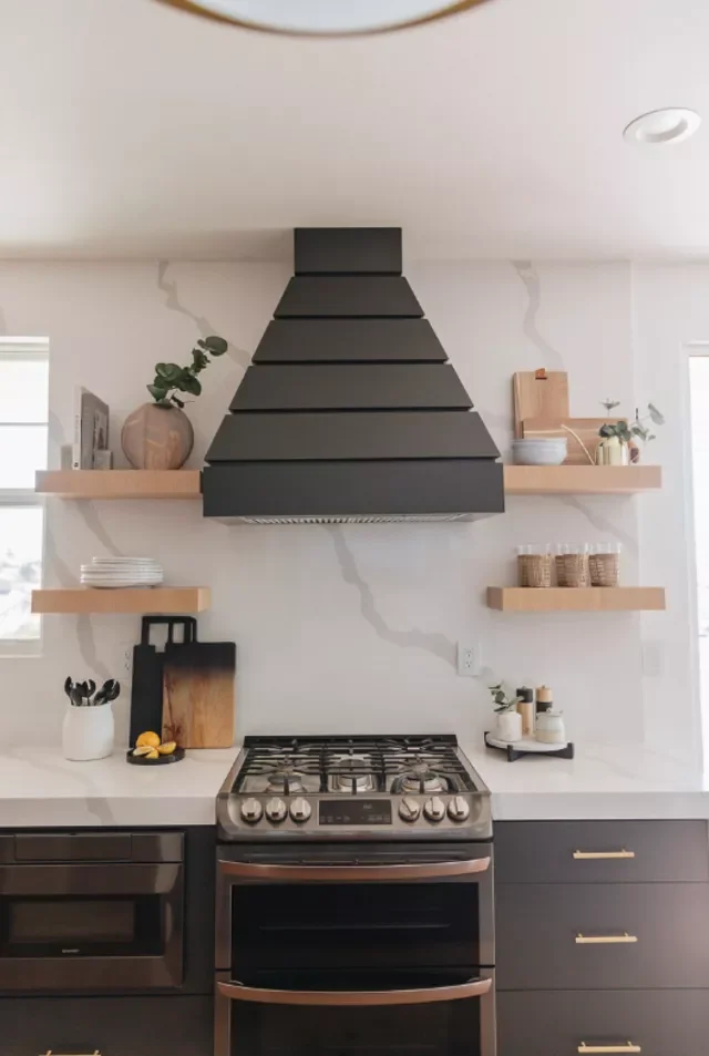18 Black & Gold Kitchen Ideas for Moody, Elegant Spaces 13 Using a Vent Hood to Add Color