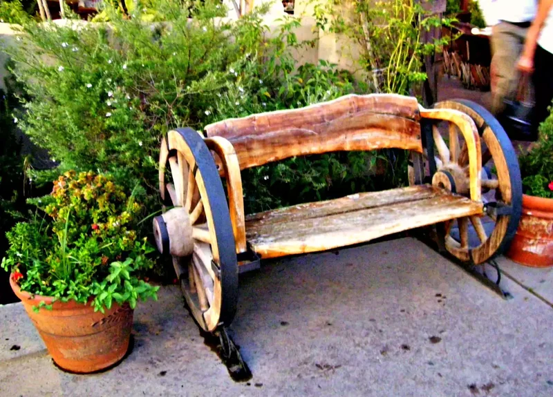 15 Beautiful Garden Bench Ideas to Transform Your Yard 8 Wagon Wheel Bench