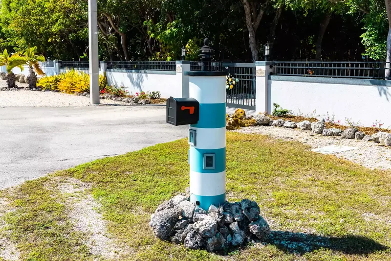 27 Mailbox Post Ideas That'll Boost Your Curb Appeal 4 Whimsical Lighthouse Post