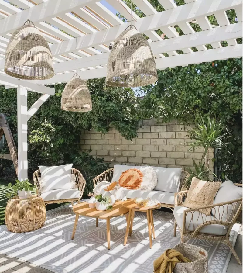 White Pergola With Wicker Accents