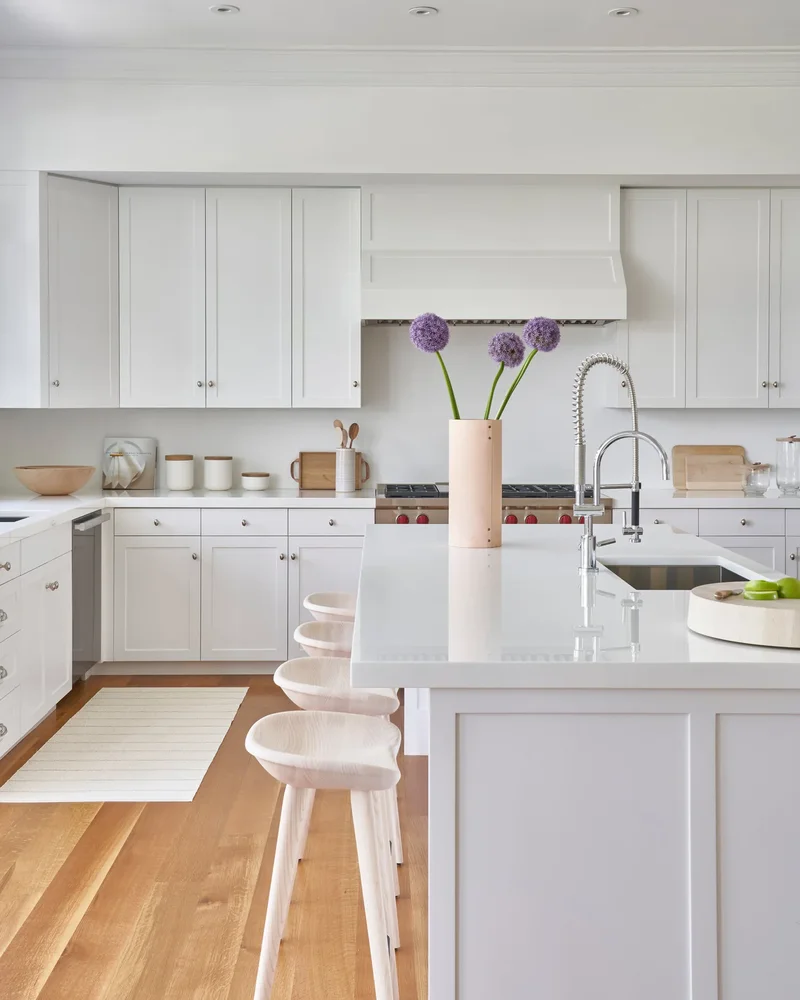 16 Coastal Kitchen Designs That Channel Nancy Meyers Vibes 12 White Shaker Cabinetry