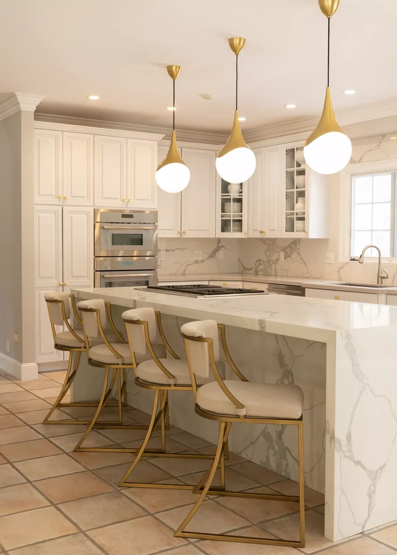White and Gold Kitchen With Elevated Seating