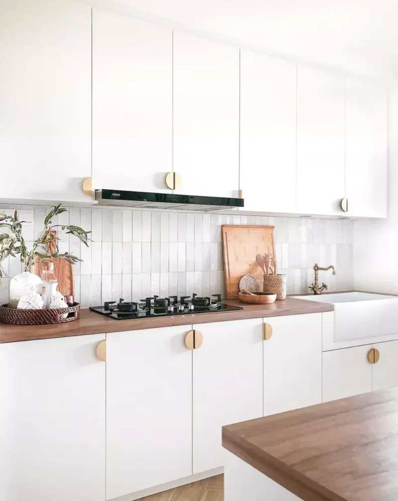White and Gold Kitchen With Statement Hardware