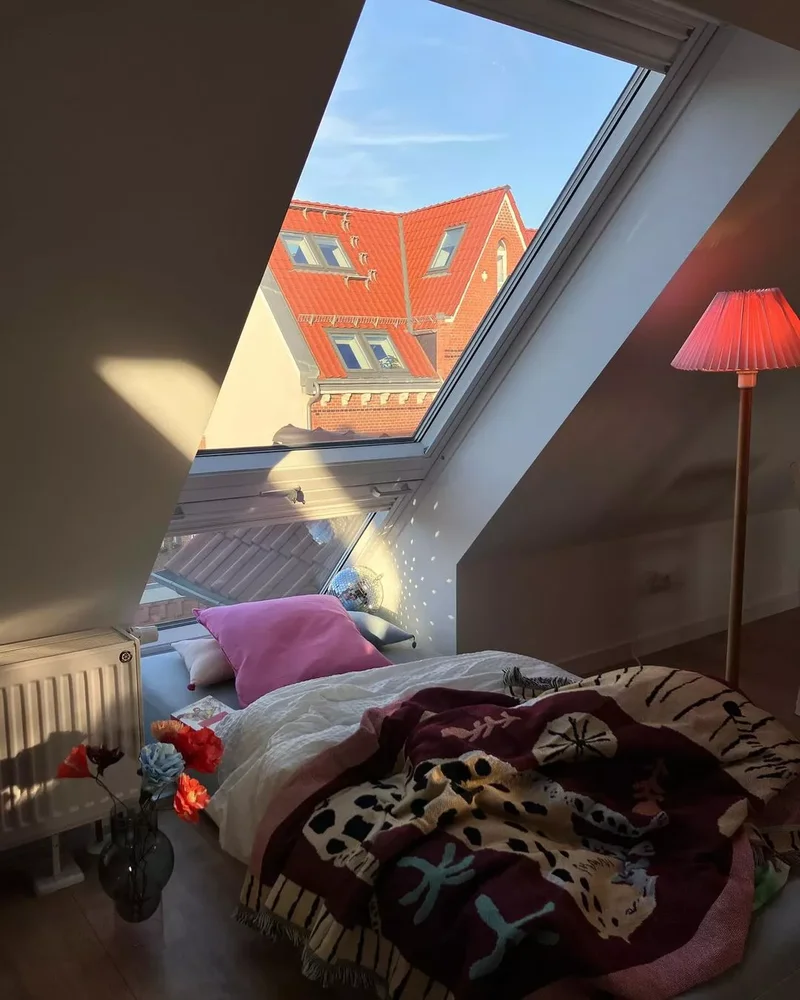 28 Sloped Ceiling Bedroom Ideas That Maximize Your Space 1 Window Nook