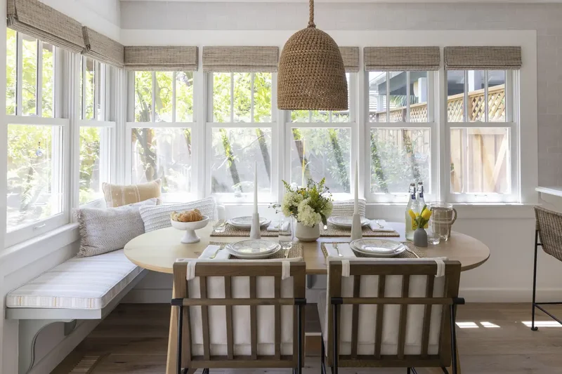 16 Coastal Kitchen Designs That Channel Nancy Meyers Vibes 6 Window Seat Dining Nook