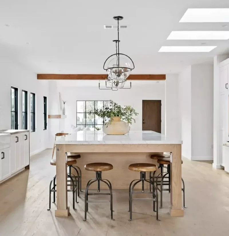 34 White & Wood Kitchen Designs That Feel Fresh and Timeless 10 Wood-and-Stone Island With White Shaker Cabinets