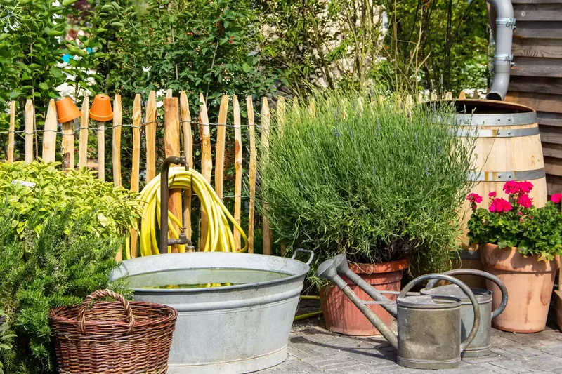 15 Clever Garden Hose Storage Solutions for Your Backyard 14 Wrap It Around an Outdoor Spigot
